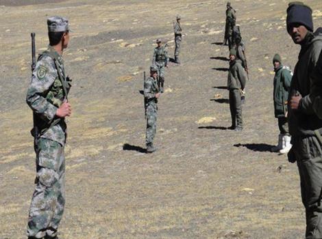 Chinese troops (left) and Indian troops during a stand-off near the LAC.